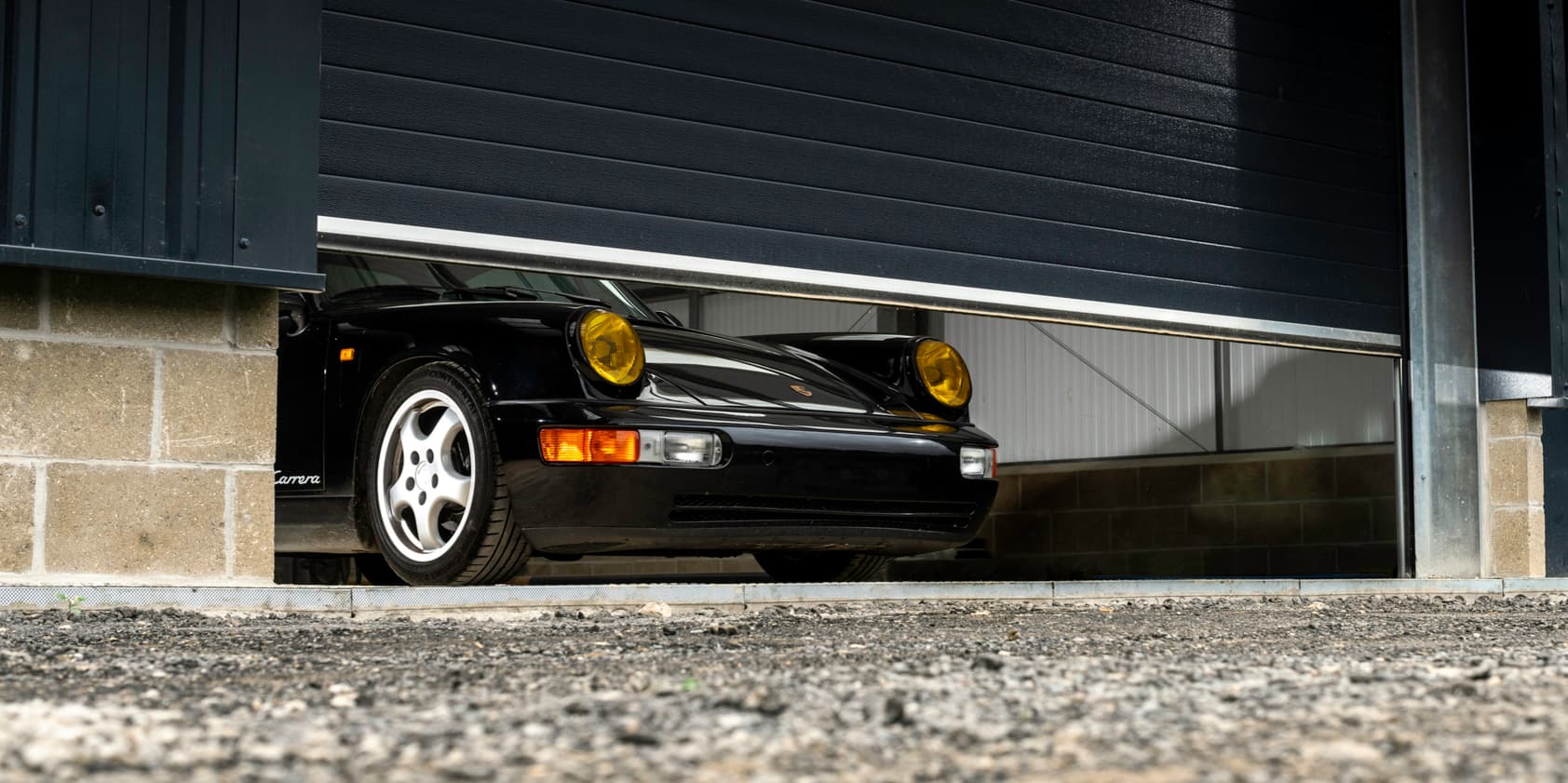 A classic Porsche in a private garage after mobile car detailing in San Diego